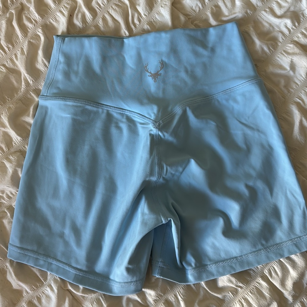 Bucked Up for her workout shorts in baby blue